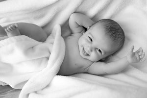image of a newborn baby laughing - Tim Downer Celebrant